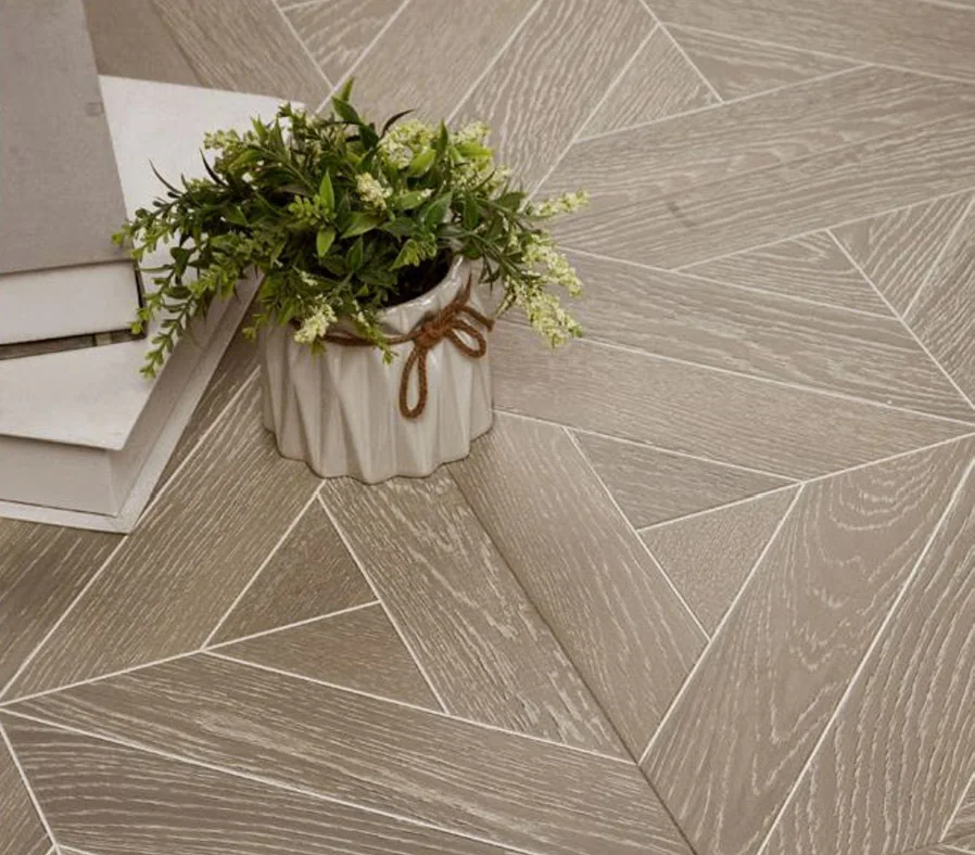 Geometric parquet floor panel pattern under a small table