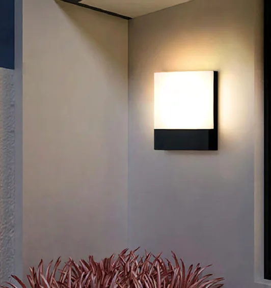 Outdoor wall light illuminating the wall around its housing