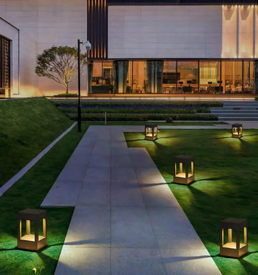 Low landscape path lights along planting in a catalogue scene