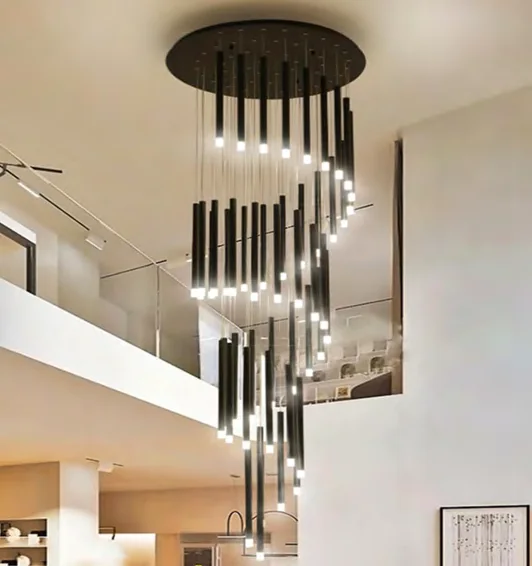Long hanging chandelier in a stair void in the lighting catalogue